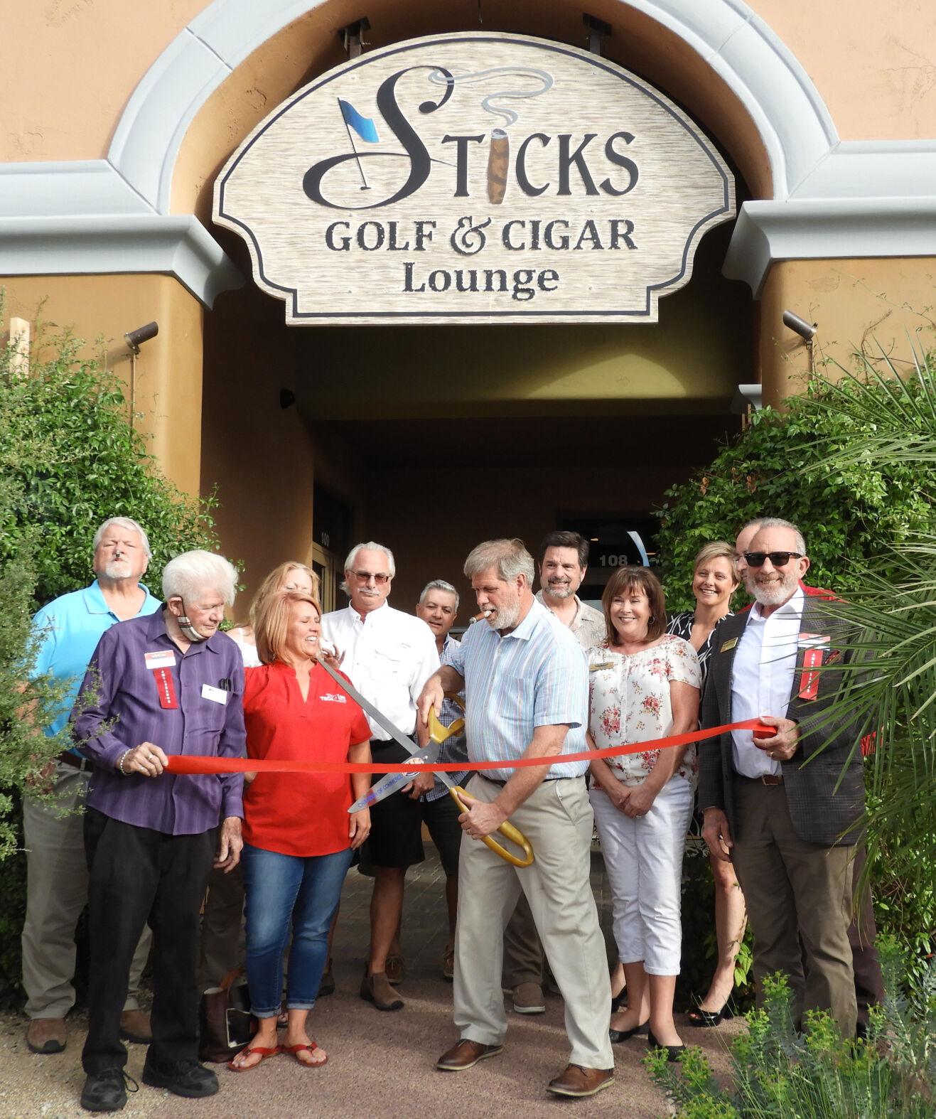 Stick’s Golf and Cigar Lounge ribbon-cutting